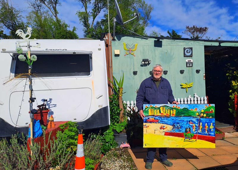 Vincent Duncan outside his caravan home